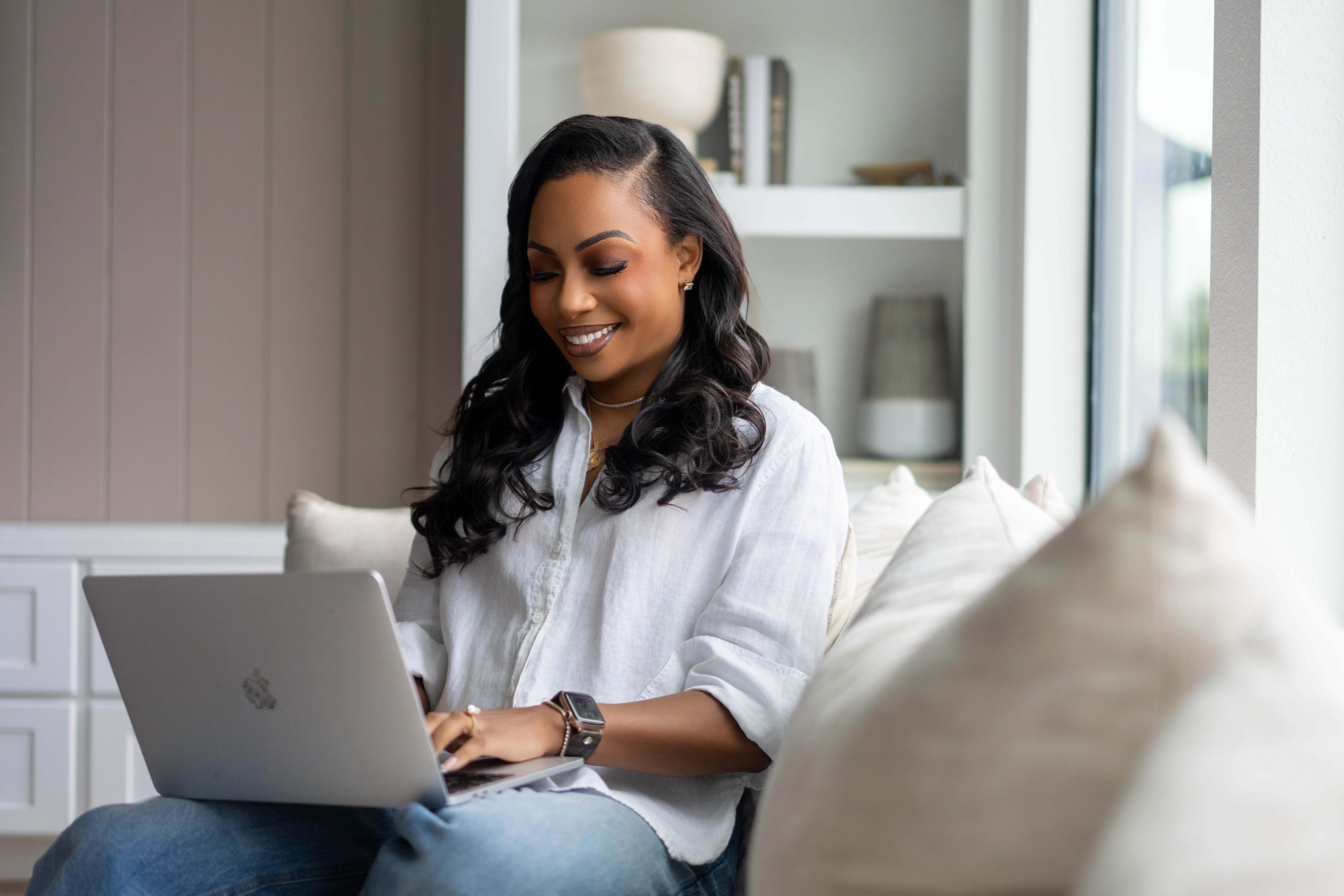 Courtney N. Williams, social media influencer working on a laptop